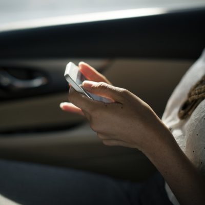 girl with mobile on her hands